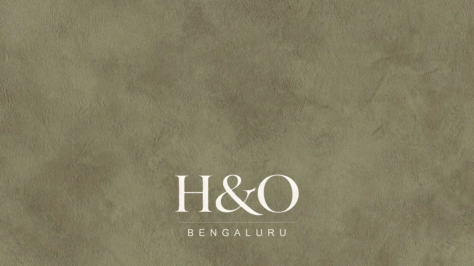 The H&O Bengaluru logo on an olive textured ground