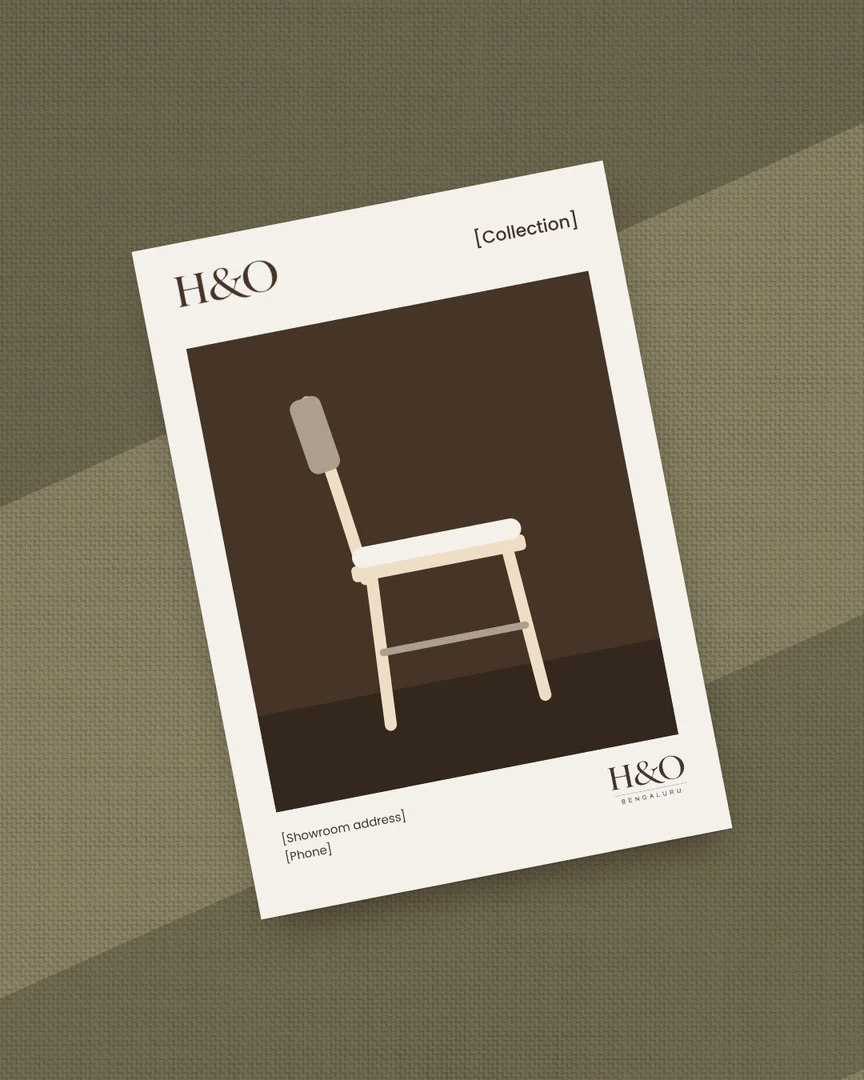 A printed card with a dining chair, lying on olive cloth